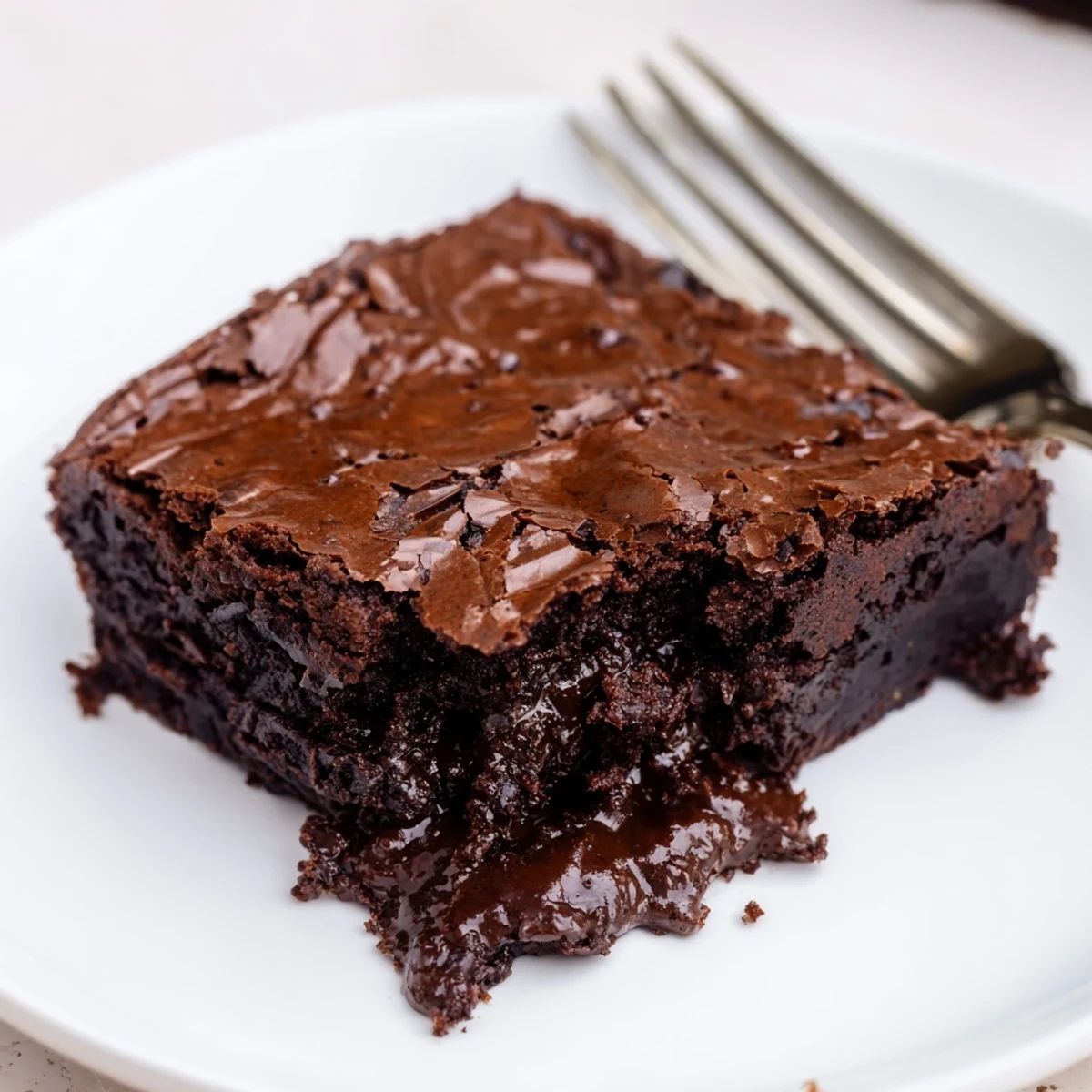 Indulge in a rich, warm serving of Ina Garten Brownie Pudding, perfect for a cozy chocolate craving.