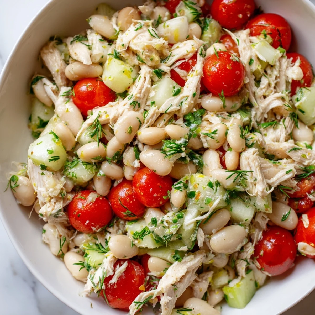 Serving suggestion for Lemony White Bean Chicken Salad featuring a colorful bowl of the protein-packed salad, ideal for a refreshing gluten-free summer dinner.