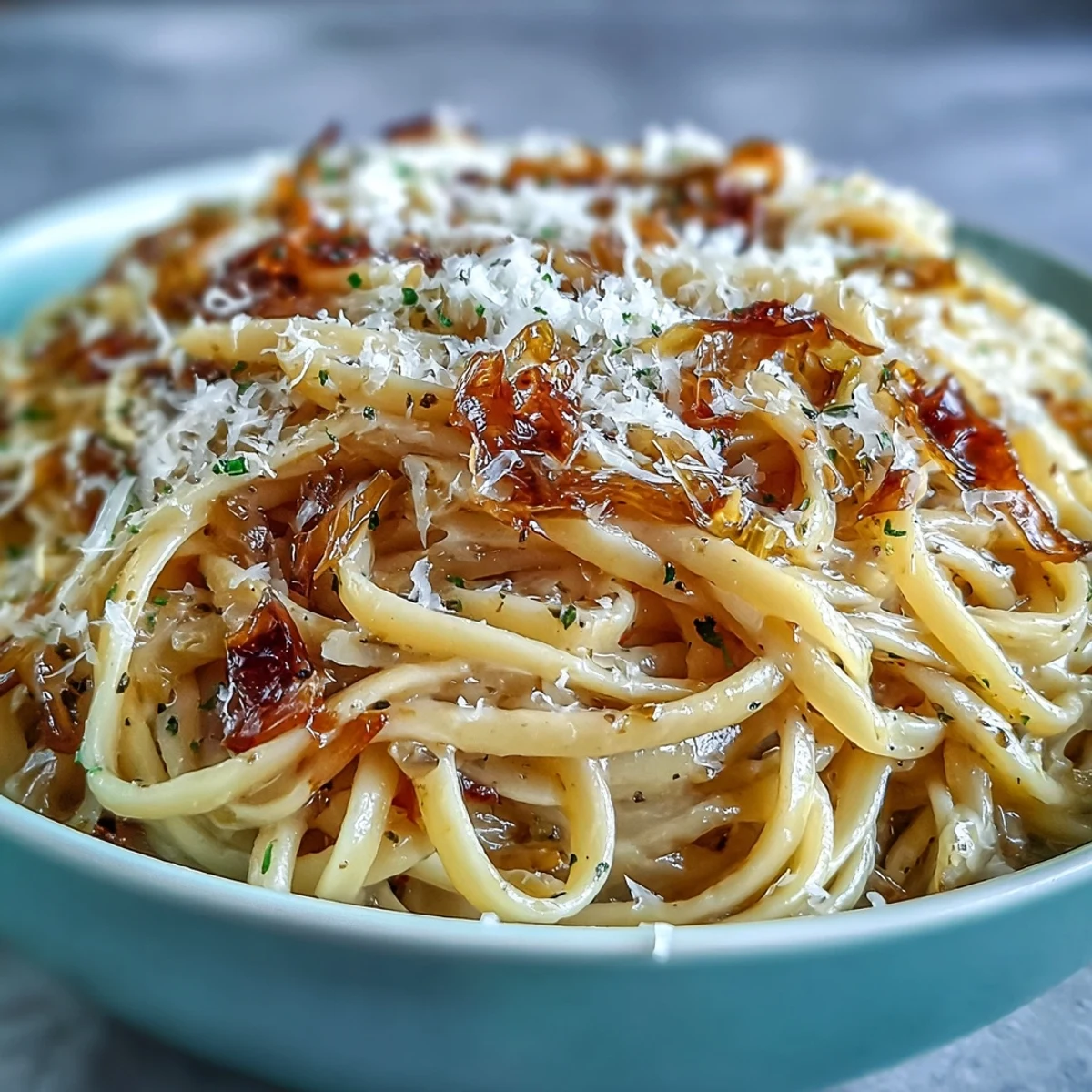 Cabbage Pasta with Garlic and Parmesan served in a white bowl, steaming and topped with fresh parsley.