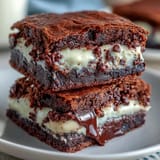 Decadent brownie cookies with a gooey cream cheese center—perfect for chocolate lovers craving a rich, indulgent treat.