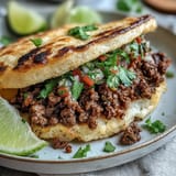 Lighter cloud bread tacos loaded with seasoned ground beef and fresh, zesty toppings.