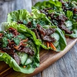 Fresh Korean BBQ beef wraps bursting with savory kimchi and cool cucumber.