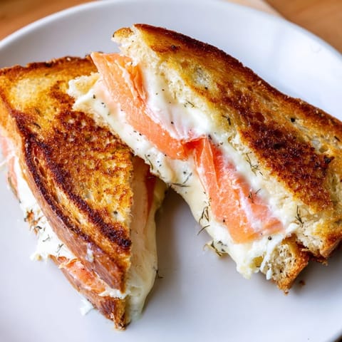 Imagine a perfectly toasted Smoked Salmon Grilled Cheese oozing with creamy cheese and savory salmon.