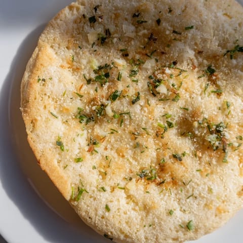 Herb-infused cloud bread toasts displayed beside a creamy dip, perfect for a gluten-free snack.  