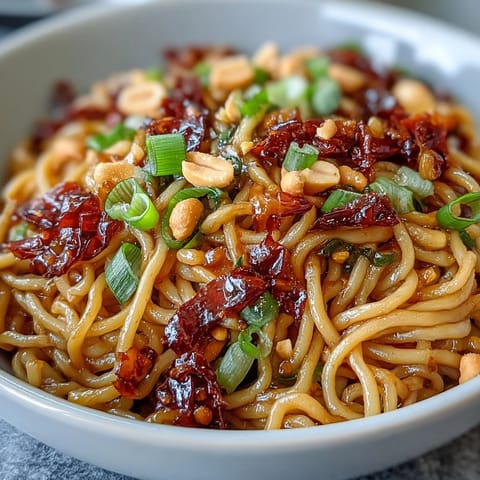 Chili Crisp Noodles: a vibrant, savory dish with tender noodles, crisp garlic, and a spicy punch.