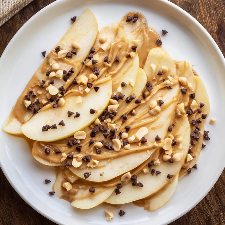 Sweet honey and crunchy nuts adorn these easy-to-make Peanut Butter Apple Nachos for everyone.