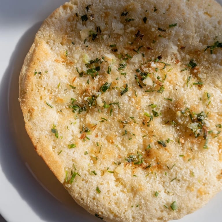 Herb-infused cloud bread toasts displayed beside a creamy dip, perfect for a gluten-free snack.  
