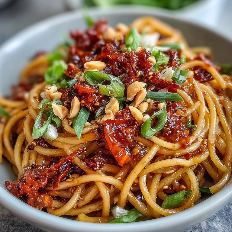 Quick and delicious Chili Crisp Noodles, perfect for a weeknight meal with fresh scallions.